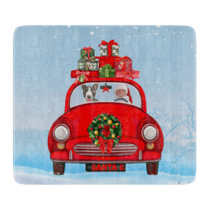 Bull Terrier Dog In Car With Santa Claus  Cutting Board