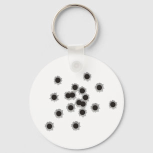 Bullet holes from a rifle or gun, possibly shotgun keychain