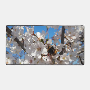 Bumblebee on wild cherry bloom desk mat