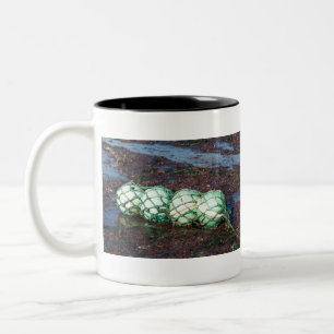 Buoy on the sand Two-Tone coffee mug