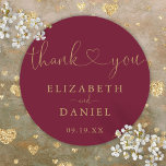 Burgundy Gold Heart Script Thank You Wedding Favou Classic Round Sticker<br><div class="desc">Elegant burgundy and gold heart script thank you sticker personalized with your names and special date. Designed by Thisisnotme©</div>