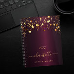 Burgundy gold stars name elegant 2025 planner<br><div class="desc">A dark burgundy background, decorated with faux gold dripping stars. Personalize and add a name and a title. The name is written with a golden modern hand lettered style script with swashes. Perfect for school, work or organizing your personal/family life. To keep the swashes only delete the sample name, leave...</div>