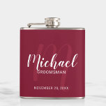 Burgundy Red Modern Script Personalized Groomsmen Hip Flask<br><div class="desc">Add a personal touch to your wedding with personalized groomsmen flask. This flask features personalized groomsmen's name in white modern script font style and monogram in light red modern script font style as background with title and wedding date in white modern sans serif font style on burgundy red background. Also...</div>