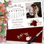 Burgundy Red & Pink Roses Wedding Calendar & Photo Save The Date<br><div class="desc">This beautiful wedding Save the Date card features a rustic boho chic design with script lettering and a cluster of hand painted watercolor roses in shades of burgundy, red, and blush pink. There is a customizable calendar where you can put a heart around your wedding date with space for your...</div>