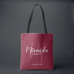 Burgundy Red Script Personalized Bridesmaids Tote Bag<br><div class="desc">Add a personal touch to your wedding with personalized bridesmaids gift tote bag. This tote bag features personalized bridesmaid's name in white modern script font style and monogram in light red modern script font style as background with title and wedding date in white modern sans serif font style on burgundy...</div>
