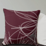 Burgundy Wine Grey Abstract Ribbon Design Throw Pillow<br><div class="desc">Burgundy and grey throw pillow features an artistic abstract ribbon composition with shades of grey and burgundy with white accents on a rich burgundy background. This abstract composition is built on combinations of repeated ribbons, which are overlapped and interlaced to form an intricate and complex abstract pattern. The shades of...</div>