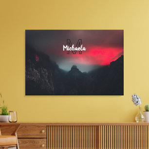 Burning clouds, fog and mountains monogram in sky canvas print