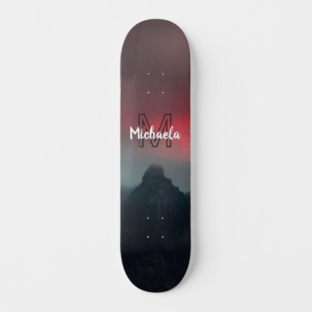 Burning clouds, fog and mountains monogram in sky skateboard (Front)