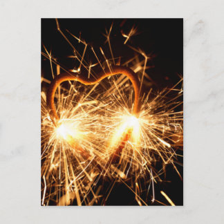 Burning sparkler in form of a heart postcard