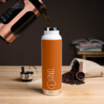 Burnt Orange Modern Typography Personalized Water Bottle<br><div class="desc">Trendy, vacuum insulated water bottle that features personalized name in white, modern typography on a trendy, burnt orange colour background. Personalize bottle by editing name and replacing name with your own as desired. Perfect for a birthday gift, wedding groomsman gift, etc. Select your water bottle style. Select your water bottle...</div>
