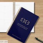 Business Logo Navy Blue and Gold Planner<br><div class="desc">Stay organized and professional with this sleek navy blue and gold business planner, fully customizable with your company logo, name, and year. Perfect for corporate branding, this spiral-bound planner is designed to keep your team meetings, client appointments, and daily tasks in check. Ideal for promotional giveaways, employee branding, and client...</div>