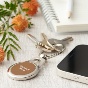 Business Logo With Brown Background on Oval Metal Keychain