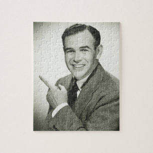 Businessman Pointing Jigsaw Puzzle