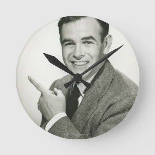 Businessman Pointing Round Clock