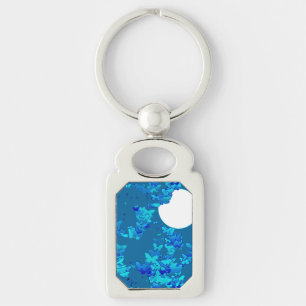 Butterflies against blue night sky, moonscape keychain