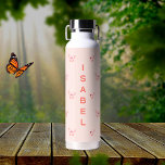 Butterflies peach rose gold name water bottle<br><div class="desc">Peach coloured background decorated with pink and rose gold butterflies.  Personalize and add your name.  Peach coloured letters.</div>