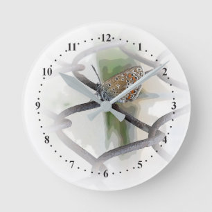 butterfly on fence round clock