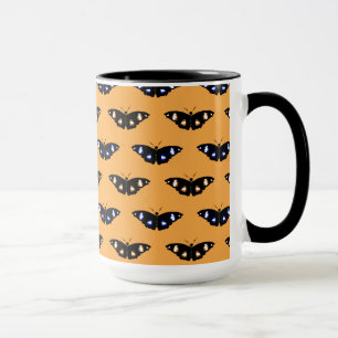 Butterfly pattern on orange background mug
