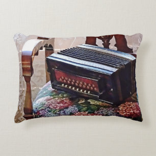 Button Accordion on Chair With Flowered Seat Accent Pillow