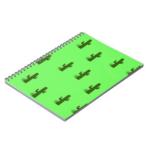 Cactus plant on light green notebook