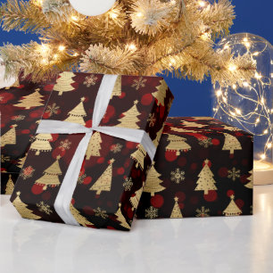 Cadeau Sapins de Noël en faux papier d'or et bokeh rouge