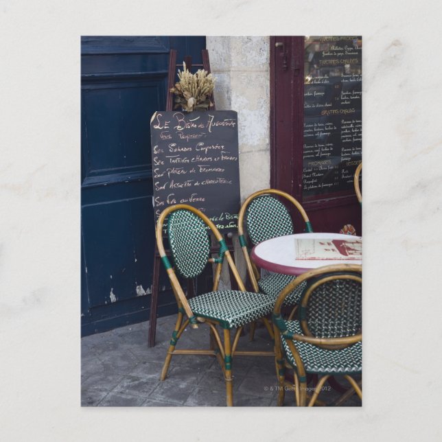 Cafe table with cane chairs in Paris, France Postcard (Front)