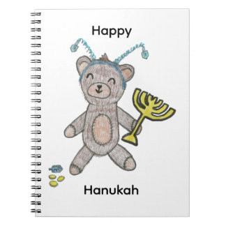 Cahier relié en spirale avec un ours en peluche mi