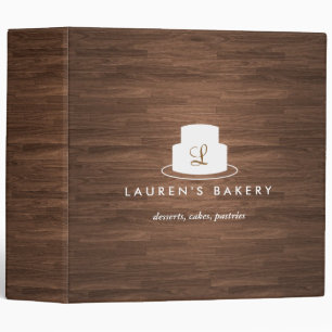 Cake Monogram Logo in White on Brown Woodgrain Binder
