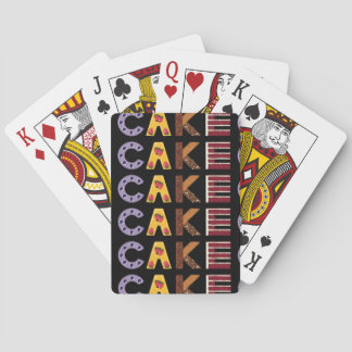 Cake word made out of pastries, layered and bar ca playing cards