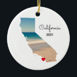California Vacation Places Visited Ceramic Ornament<br><div class="desc">Add a photo over the top of the map shape of the state of California. My sample photo was taken during a road trip to the aquarium and beach near Monterey Bay. You can change the heart colour, move it, or delete that text symbol. Personalized text on back with information...</div>