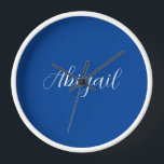 Calligraphy Elegant Blue White Plain Simple Name Clock<br><div class="desc">Looking for a beautiful calligraphy with an aesthetic handwriting? This simple, eye-catching design is for you. This product immediately impresses those who see it. The fine and tasteful design will immediately reflect the quality of your relationship and family.</div>