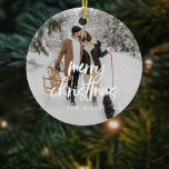Calligraphy Merry Christmas Photo Ceramic Ornament<br><div class="desc">Celebrate the magic of the season with a personalized Christmas ceramic ornament that beautifully captures your memories! Featuring the festive greeting "Merry Christmas" in modern brush calligraphy, this ornament overlays your favourite photo, creating a heartfelt keepsake for your tree. On the back, you can add another cherished photo, making it...</div>