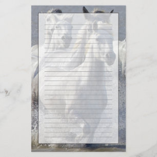 Camargue horses running on marshland to cross stationery