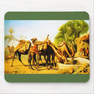 Camels drinking at an oasis mouse pad