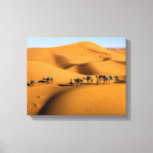 camels on desert under blue sky canvas print