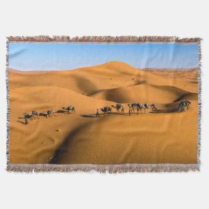 camels on desert under blue sky throw blanket