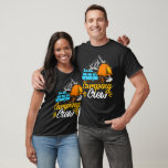 Camping Crew Camper Van T-Shirt<br><div class="desc">This black t-shirt features a camping-themed graphic. A light blue camper van with luggage on top is parked near an orange tent. A person is sitting by a campfire. In the background, a sketched mountain range is visible. The text "Camping" is written in a stylized orange script above "Crew" in...</div>