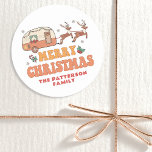 Camping Merry Christmas Reindeer Personalized Name Classic Round Sticker<br><div class="desc">Camping Merry Christmas Reindeer Personalized Name Stickers Labels features the text "Merry Christmas" in a retro script typography with a festive decorated caravan being pulled by reindeer and accented with snowflakes and holly. Personalize with your custom name. Designed by Evco Studio www.zazzle.com/store/evcostudio</div>