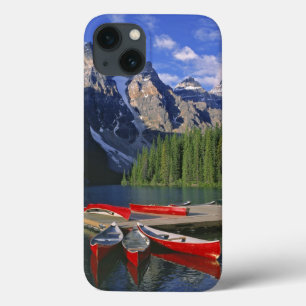 Canada, Alberta, Moraine Lake. Red canoes await iPhone 13 Case