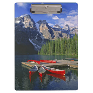 Canada, Alberta, Moraine Lake. Red canoes await Clipboard