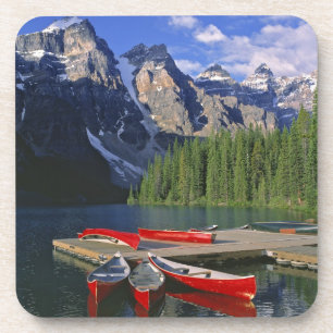 Canada, Alberta, Moraine Lake. Red canoes await Coaster