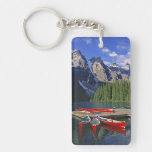 Canada, Alberta, Moraine Lake. Red canoes await Keychain