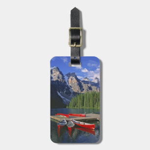 Canada, Alberta, Moraine Lake. Red canoes await Luggage Tag