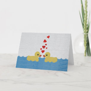 Canards dans la carte de voeux de blanc d'amour