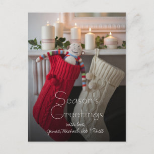 Candles lit on mantelpiece with Christmas Holiday Postcard