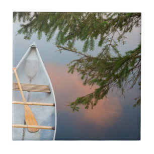 Canoe on lake at sunset, Canada Tile