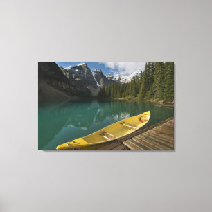 Canoe parked at a dock along Moraine Lake, Banff Canvas Print