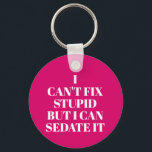 Can't Fix Stupid Keychain<br><div class="desc">Round button keychain features text "I Can't Fix Stupid,  But I Can Sedate It" on a hot pink background or any colour you choose,  perfect for a paramedic,  nurse,  or doctor. Keychains make fun gifts for family and friends or create for yourself.</div>