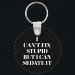 Can't Fix Stupid Keychain<br><div class="desc">Round button keychain features text "I Can't Fix Stupid,  But I Can Sedate It" on a black background or any color you choose,  perfect for a paramedic,  nurse,  or doctor. Keychains make fun gifts for family and friends or create for yourself.</div>