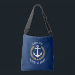 Captain Your Boat Name Anchor Gold Laurel Navy Crossbody Bag<br><div class="desc">A stylish cross-body tote bag with Captain or other title, your personalized name, boat name or other desired text. Features a custom designed nautical boat anchor with gold style laurel leaves and star on navy blue. Easily customize the base colour to match your current decor or theme. Reusable and great...</div>